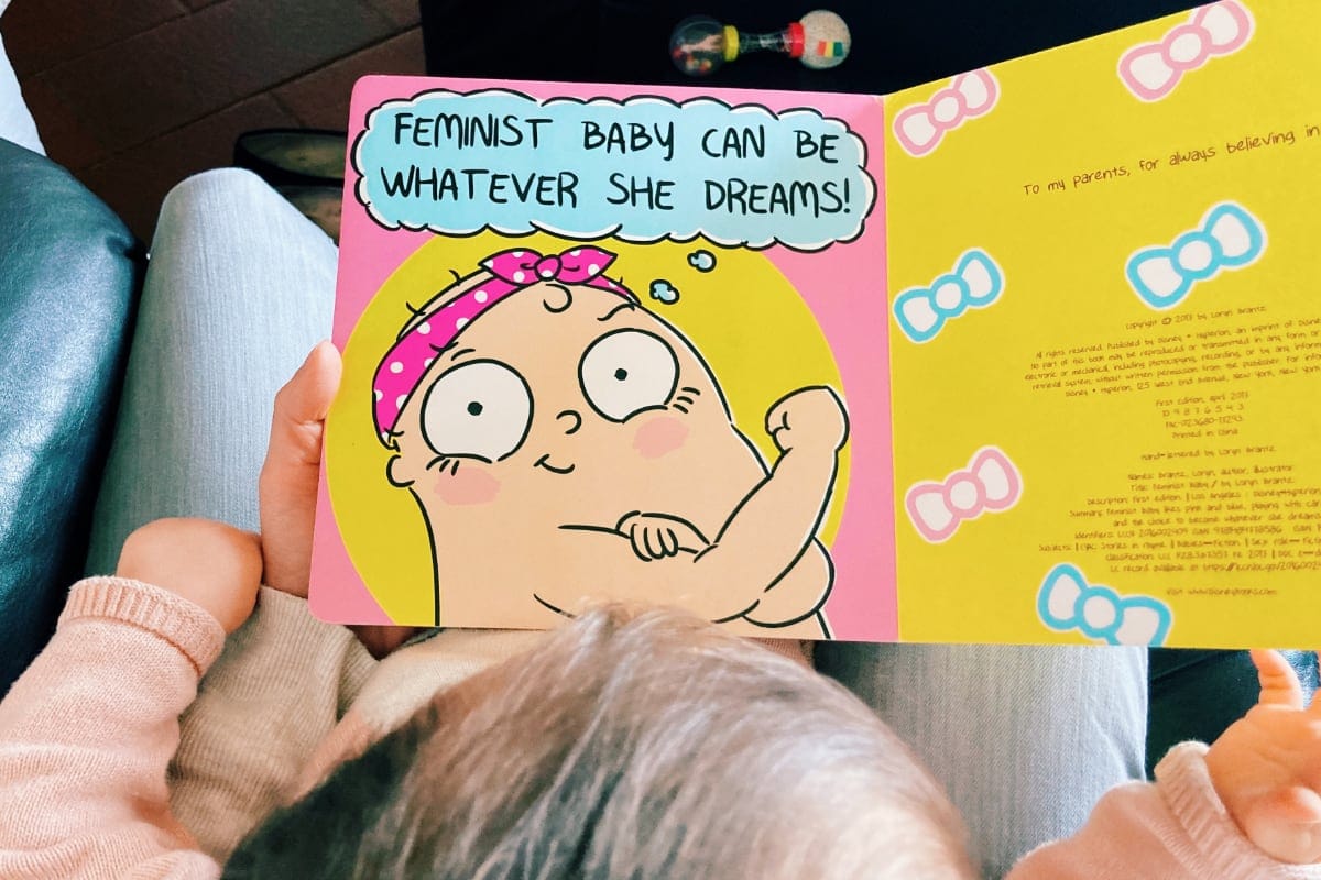 Reading Feminist Baby to my daughter - when she was an infant