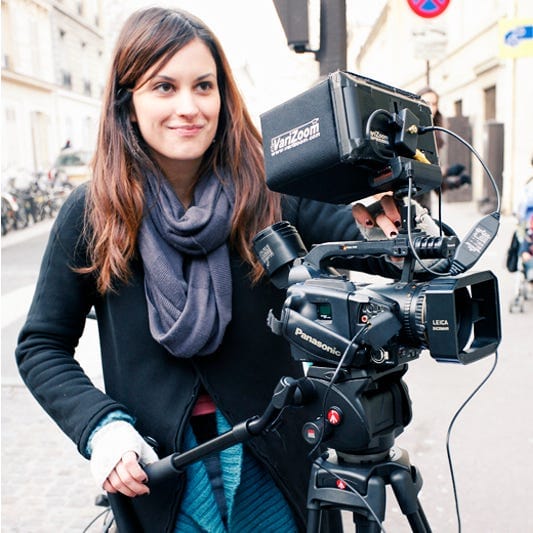 filmmaker Elena Rossini behind the camera on a Parisian street