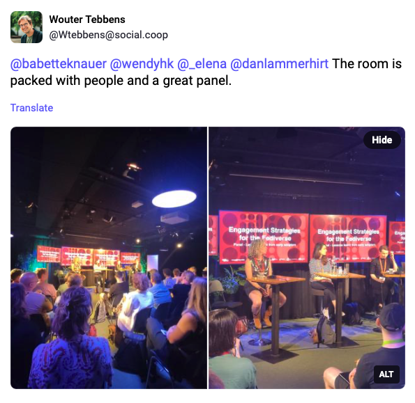 a toot by Wouter Tebbens showing photos from my panel at the conference. His message reads: The room is packed with people and a great panel"