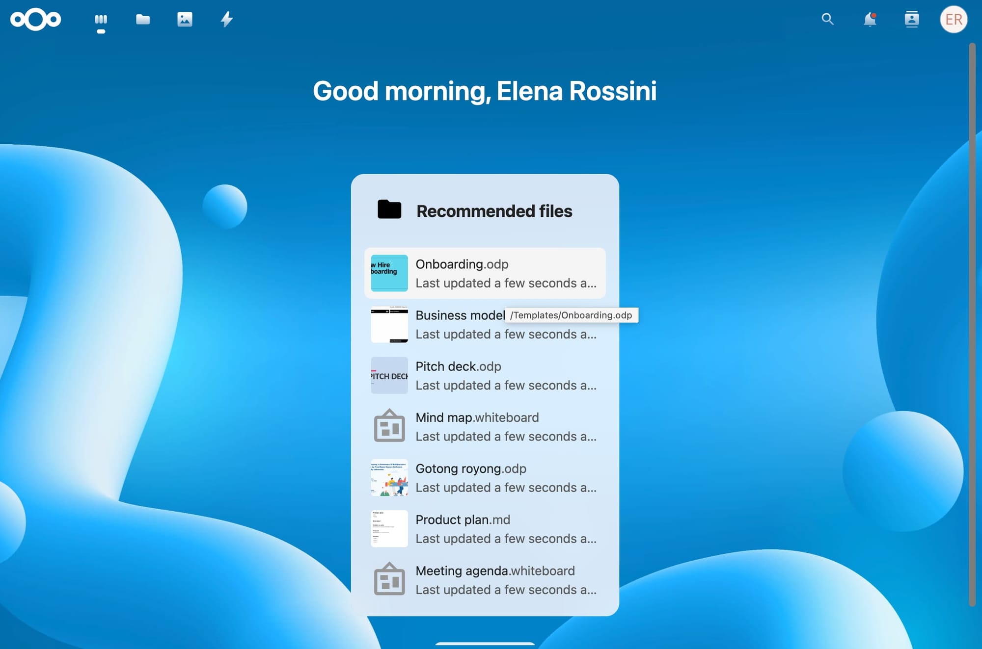 a screenshot of the main page on my self-hosted NextCloud, with an abstract blue background and the words on top: "Good morning, Elena Rossini" and under it there is a box with "Recommended Files" and 7 file previews