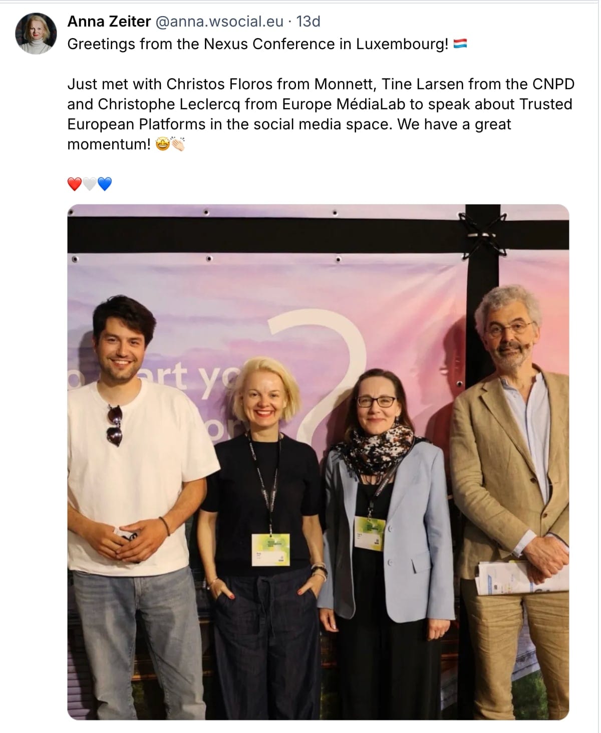 a screenshot of an ATproto post by Anna Zeiter that reads: ‪"Greetings from the Nexus Conference in Luxembourg! Just met with Christos Floros from Monnett, Tine Larsen from the CNPD and Christophe Leclercq from Europe MédiaLab to speak about Trusted European Platforms in the social media space. We have a great momentum!" and shows a photo of Floros, Zeiter, Larsen and Leclercq smiling to the camera