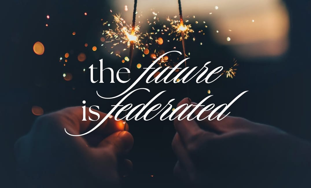 Photo by Ian Schneider showing two hands in the dark holding up sparklers. The title on top says "the future is federated"